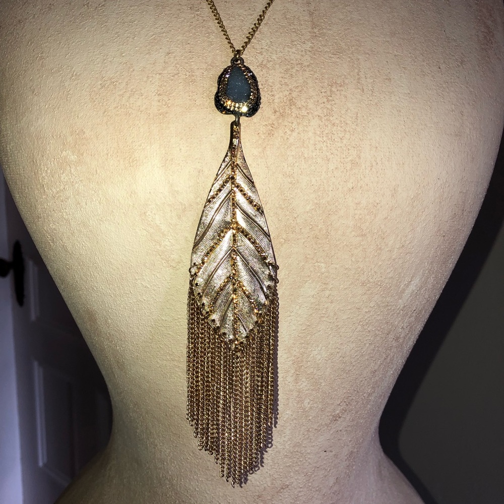 Gold necklace with feather pendant